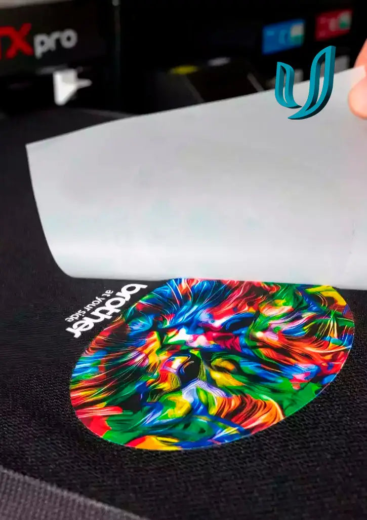 Vibrant multicolored heat transfer design on black fabric showcasing DTF Printing with unlimited colours