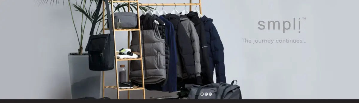 Smpli workwear and bags displayed on a wooden rack for modern uniforms style