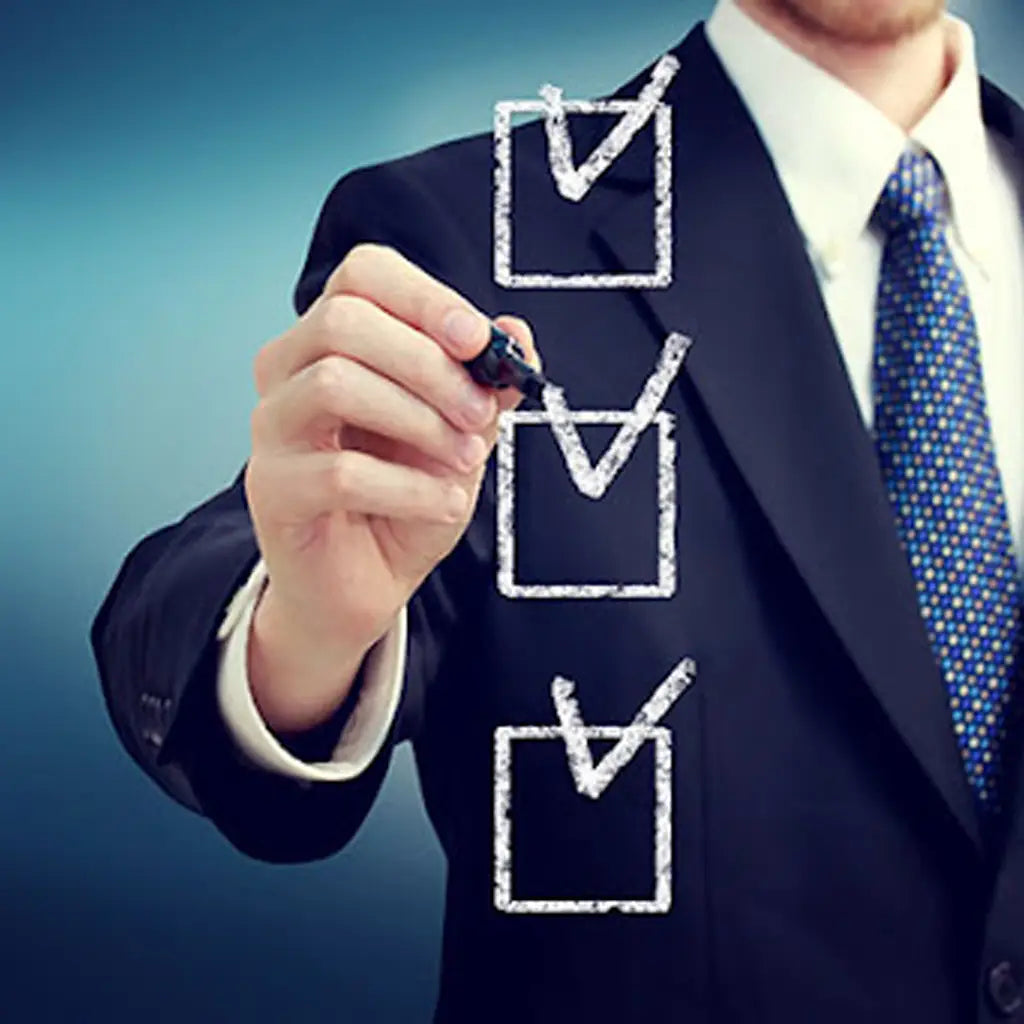 Man checks off 2026 business uniform buying checklist in suit and tie