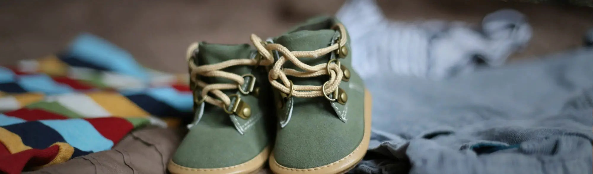Olive green baby boots from Baby Apparel collection, perfect for cute baby outfits