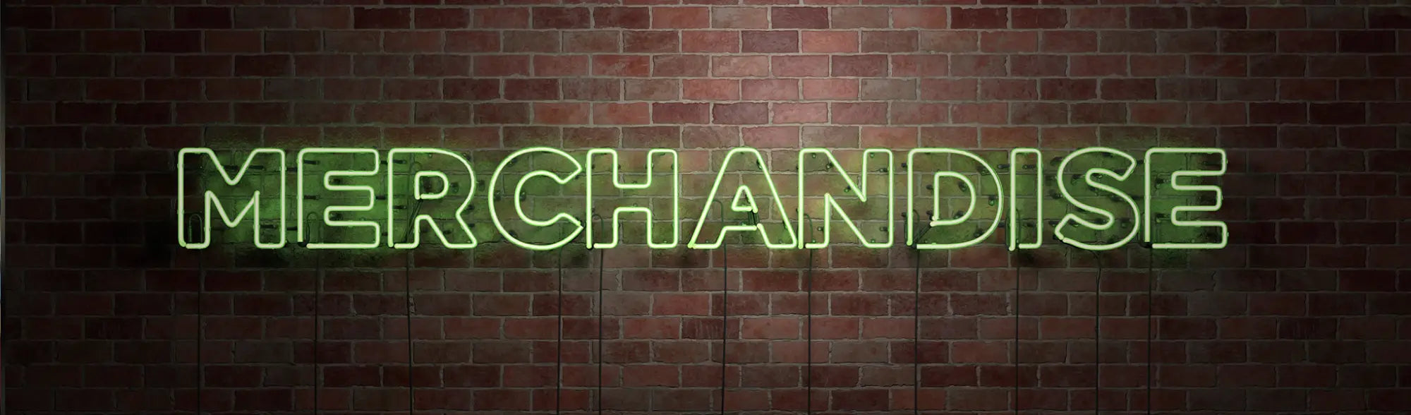 Green neon MERCHANDISE sign in a collection of promotional bags and workwear accessories