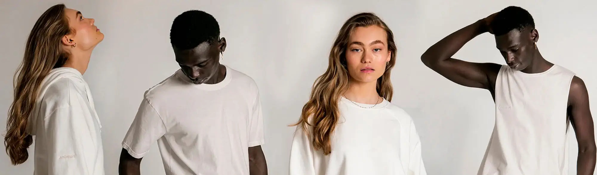 Four models showing off stylish white casual apparel from Custom Dyed Bottoms collection