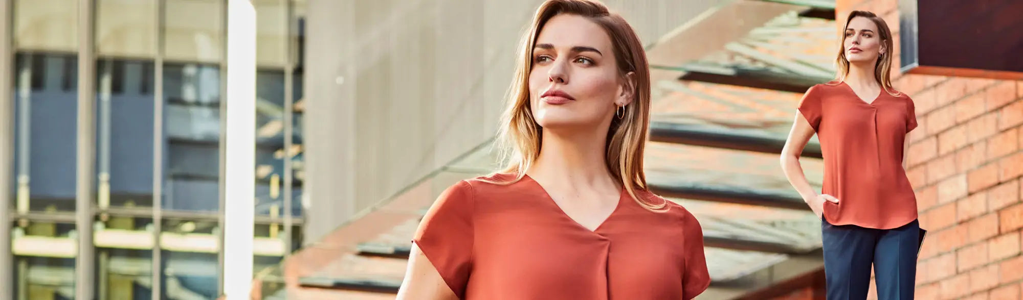 Women’s rust-colored blouse from LADIES APPAREL collection, perfect for stylish workwear