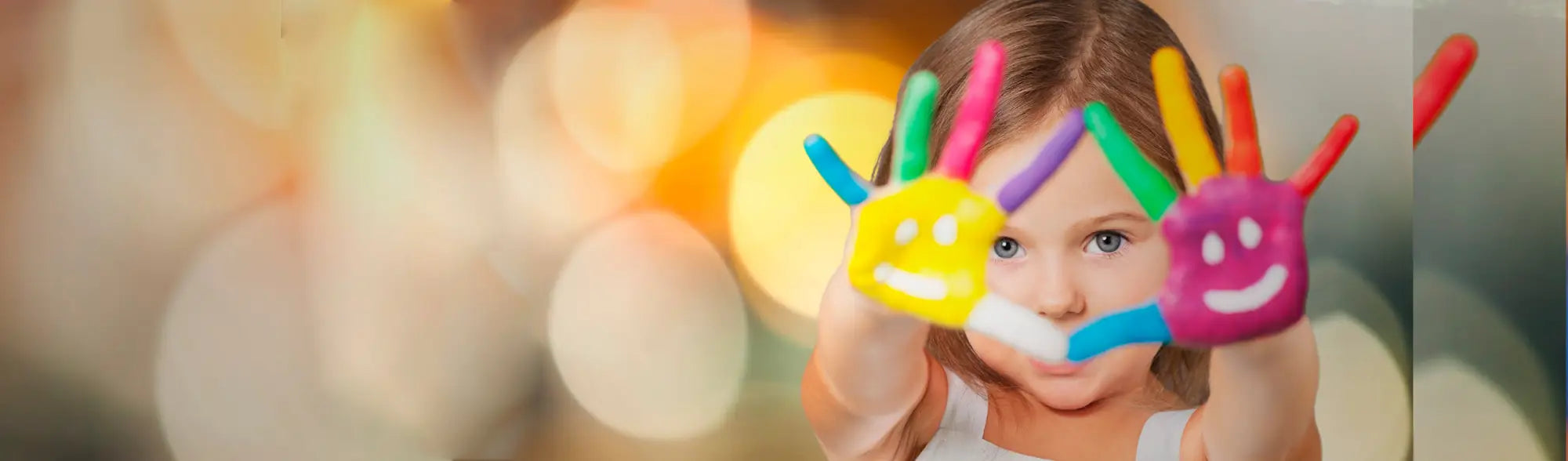 Child with painted hands in School Dresses collection showcasing fun school uniforms