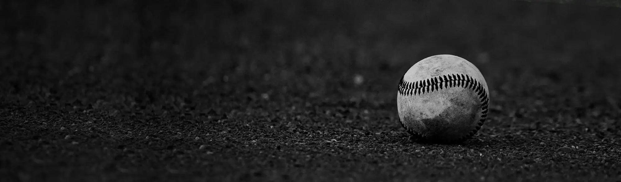 Worn baseball with visible stitching, perfect for baseball sportswear or uniforms