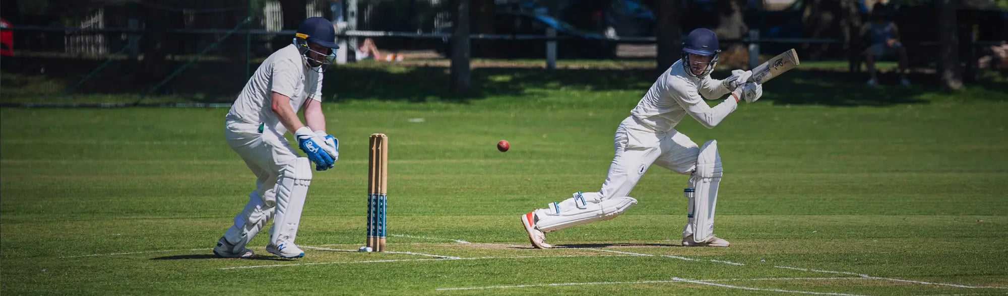 Cricket players in action wearing sports cricket teamwear and uniforms for ultimate workwear style