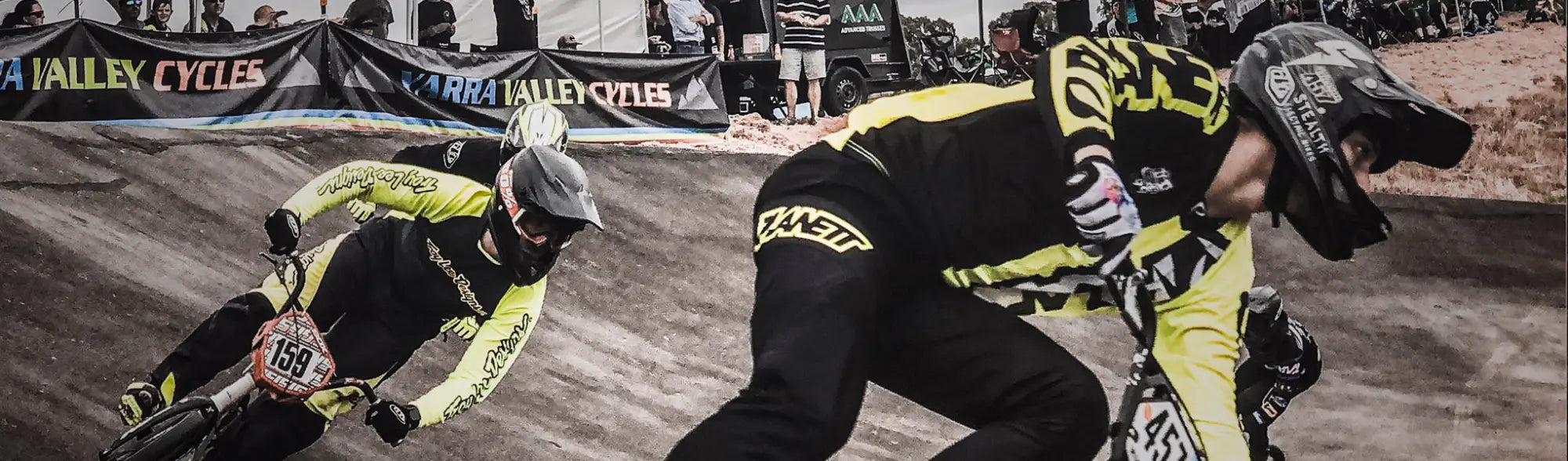 BMX racers on a track wearing custom cycling uniforms in the Sports Cycling collection