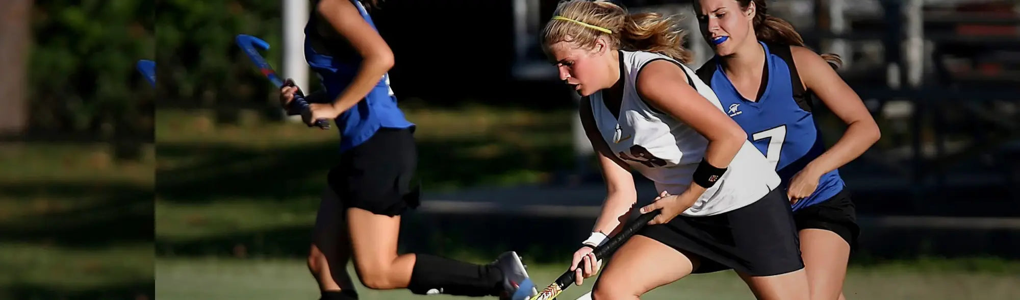 Field hockey players in action wearing team uniforms on the field Hockey collection