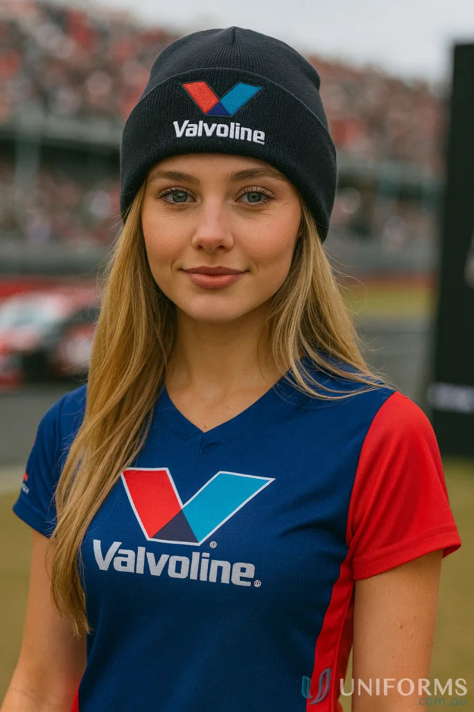 Young woman wearing a Valvoline acrylic beanie with Thinsulate lining for stylish uniforms
