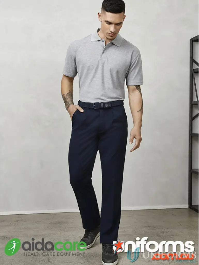 Man in gray polo and navy pants, perfect for work uniforms and great fit