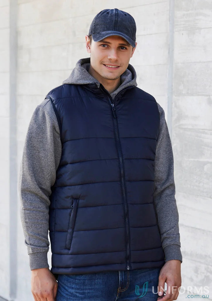 Man wearing navy Alpine Puffer Vest from Biz Collection Men’s j211m outdoor look