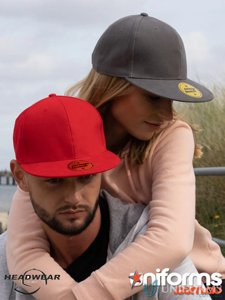 Two flat-brimmed baseball caps ideal for workwear and American uniforms with snap backs