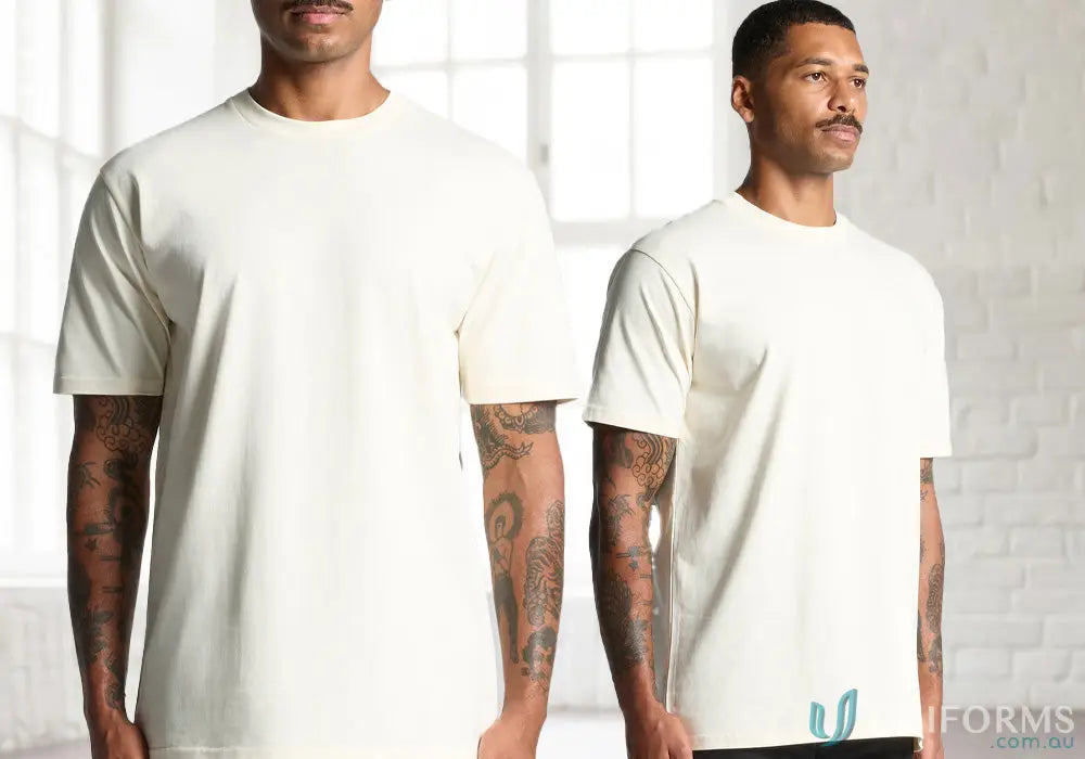 Two men wearing off-white AS Classic Tee relaxed fit shirts made from comfy combed cotton