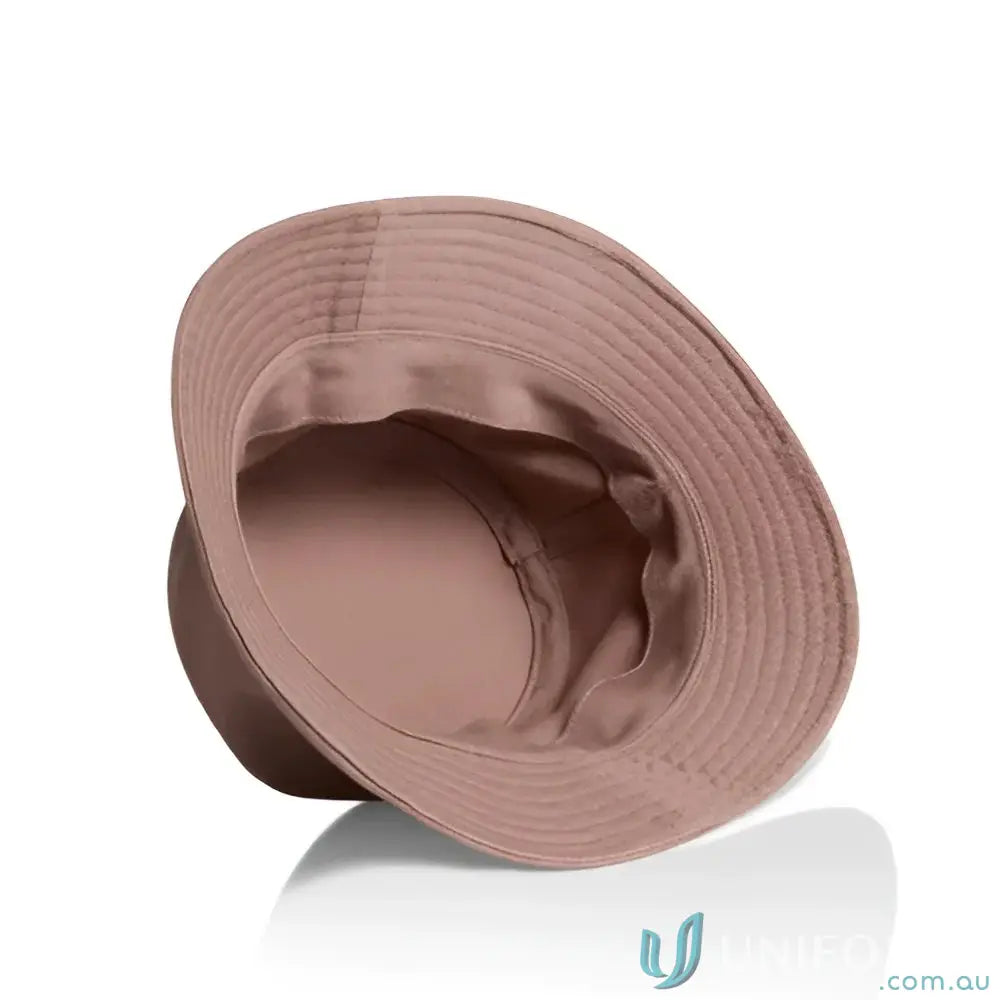 Dusty rose pink bucket hat with reinforced brim, wide brim, and lightweight cotton feel
