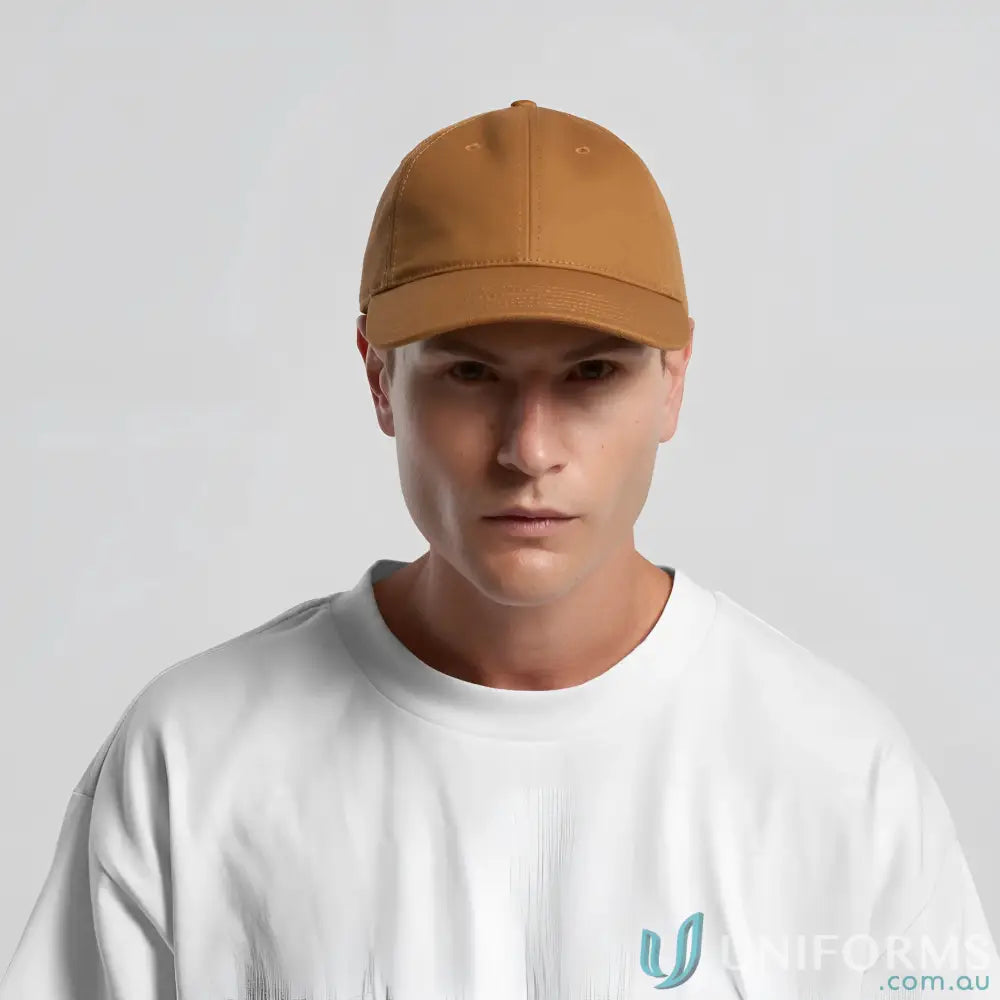 Man wearing a solid brown cotton canvas Access Canvas Cap with adjustable fit