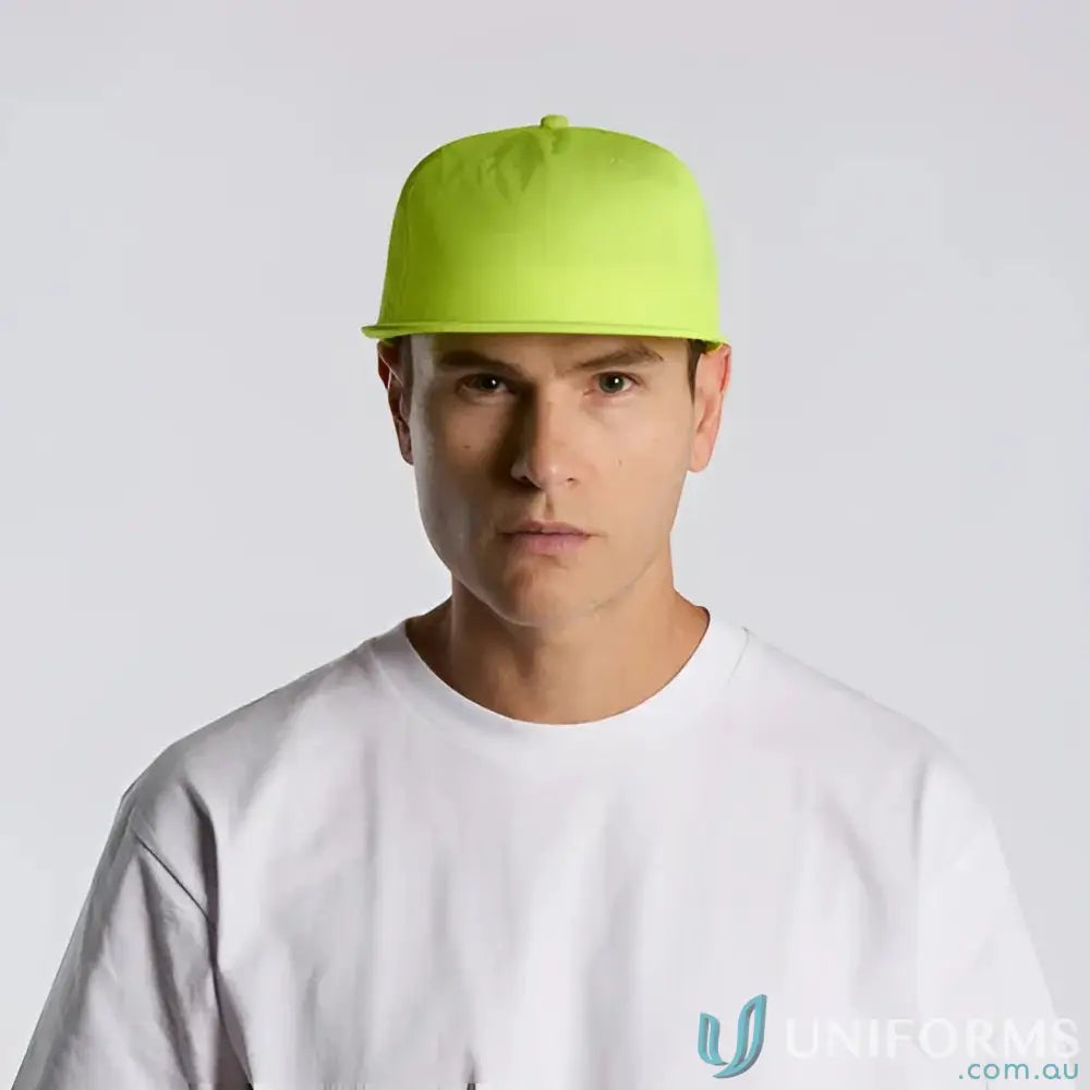 Man wearing neon green recycled nylon Colour Surf Safety Cap and white T-shirt