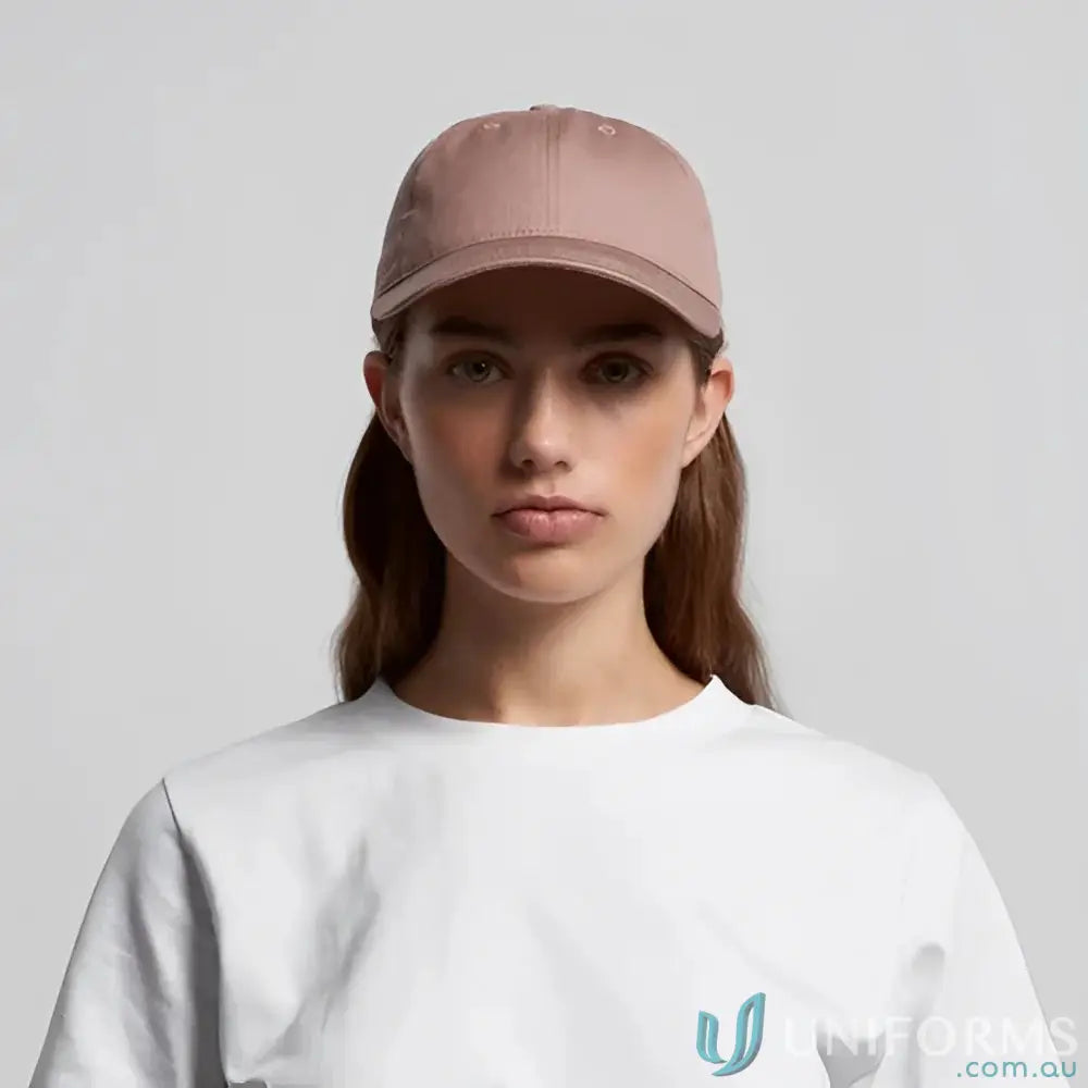 Young woman in white t-shirt and dusty rose access cap with tonal under-peak lining