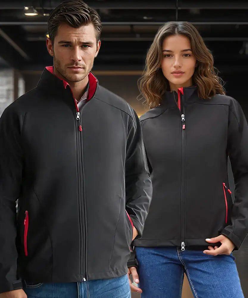 Man and woman wearing black jackets with red accents in an indoor setting