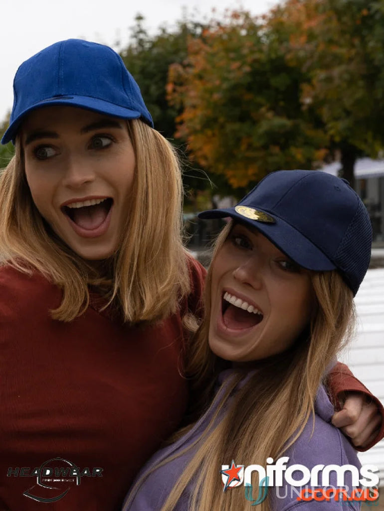 Two women wearing BHC FlexFit Cap for dream fit and stylish workwear uniforms