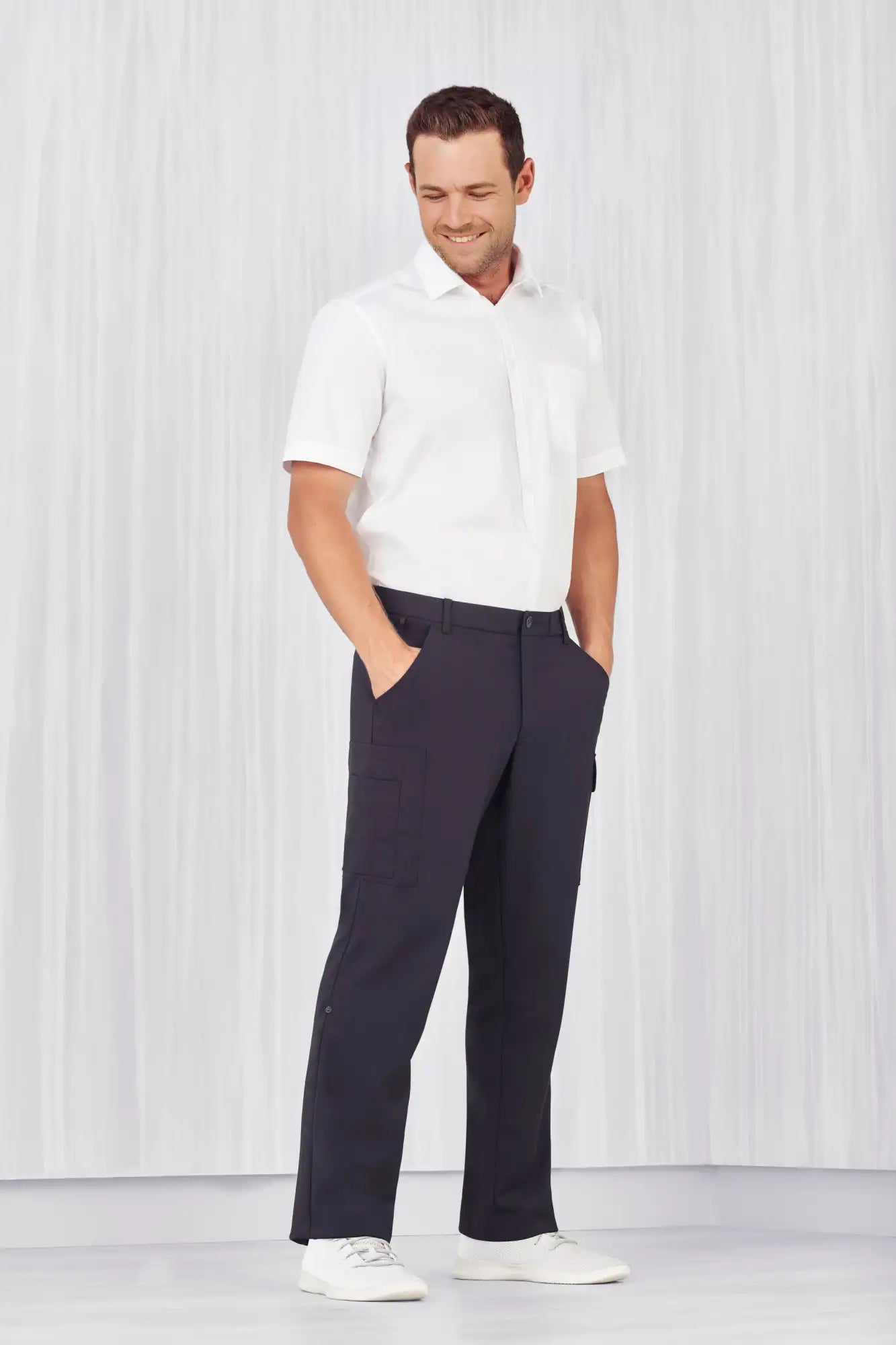 Men’s white polo shirt with comfort waist cargo pants for healthcare workers or aged care teams