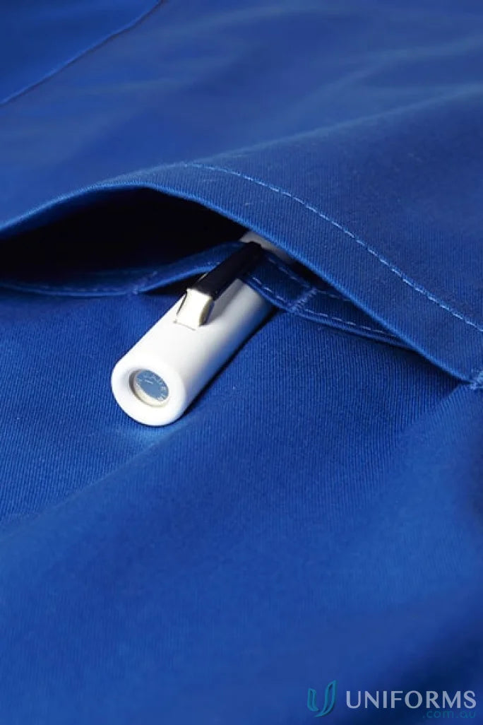 White penlight in blue pocket of Biz Riley V-Neck Scrub Top with stretch panels