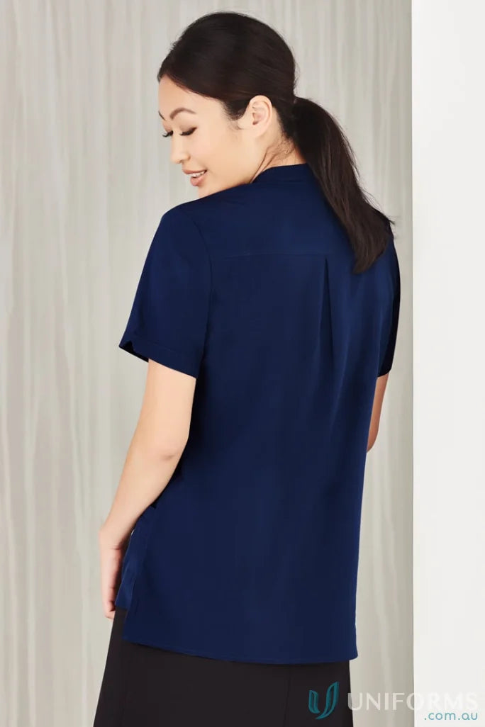 Woman in navy Bizcare Florence Plain Tunic showcasing women’s Florence plain style CS949LS
