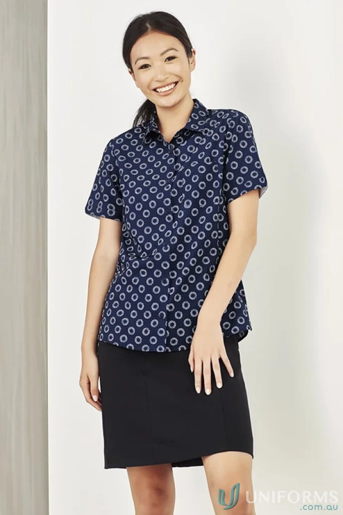Woman modeling Bizcare Stretch Daisy Print SS Shirt in navy with florence daisy print and effortless style