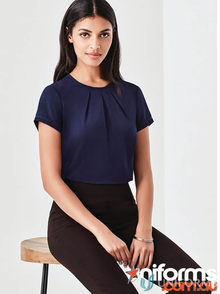 Women’s blaise navy short sleeve blouse in luxe jersey knit with black pants