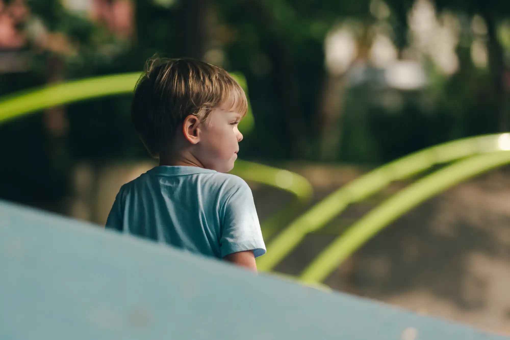Blond-haired child in blue shirt.
