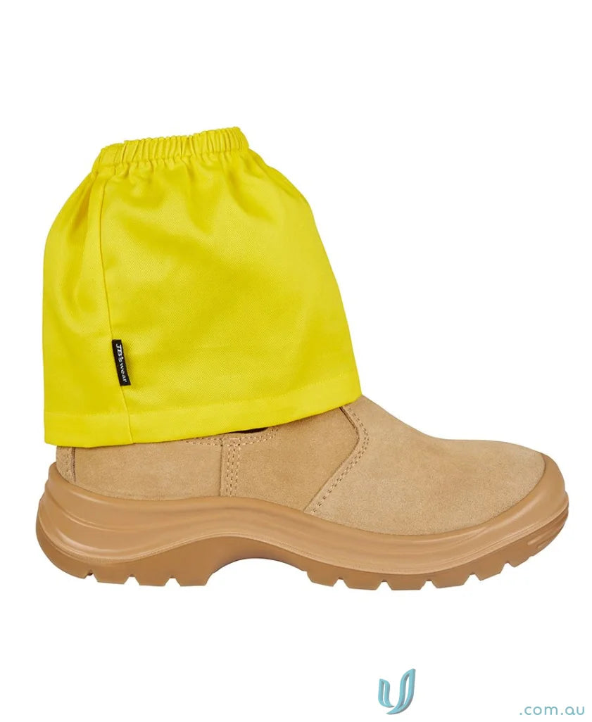 Tan work boot with yellow spats worn over workwear for perfect work uniforms style