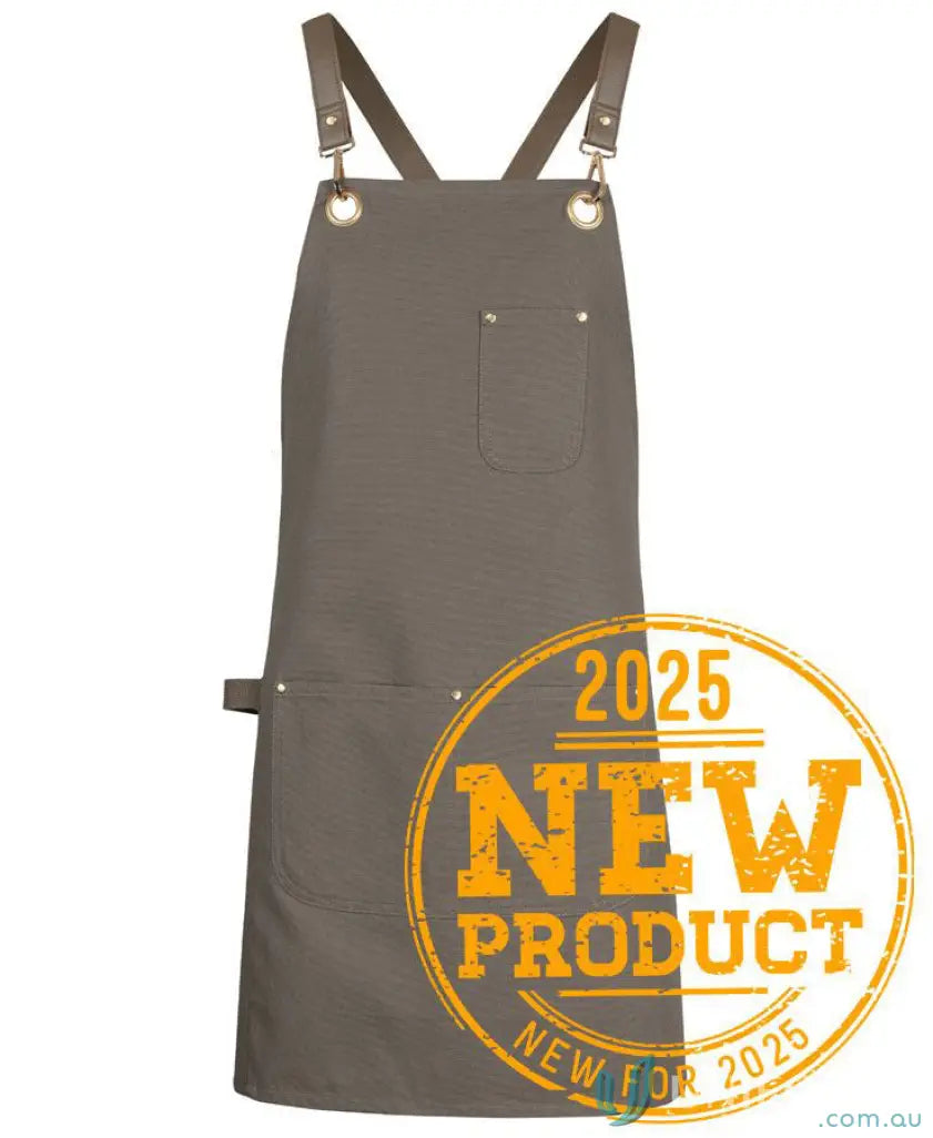 Gray eyelet canvas apron with brass eyelets and cross-back straps for ultimate style