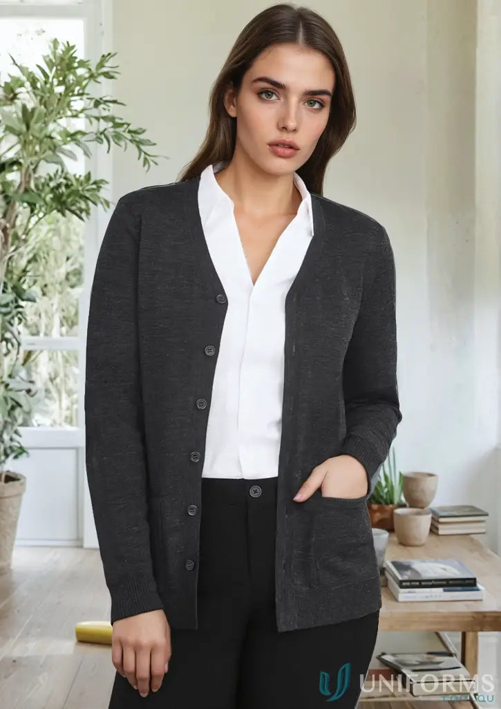 Woman wearing dark gray merino wool knit Button Front Knit Cardigan with pockets