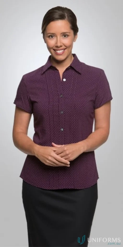 Woman wearing City Stretch Spot Ladies SS Shirt with cap sleeves and natural stretch