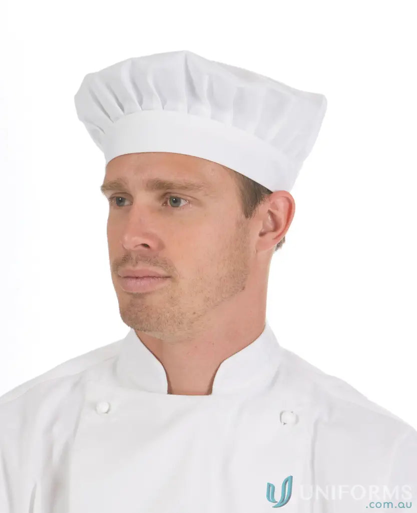 Male chef with classic beret hat showing rear adjustable hook and neatly kept hair