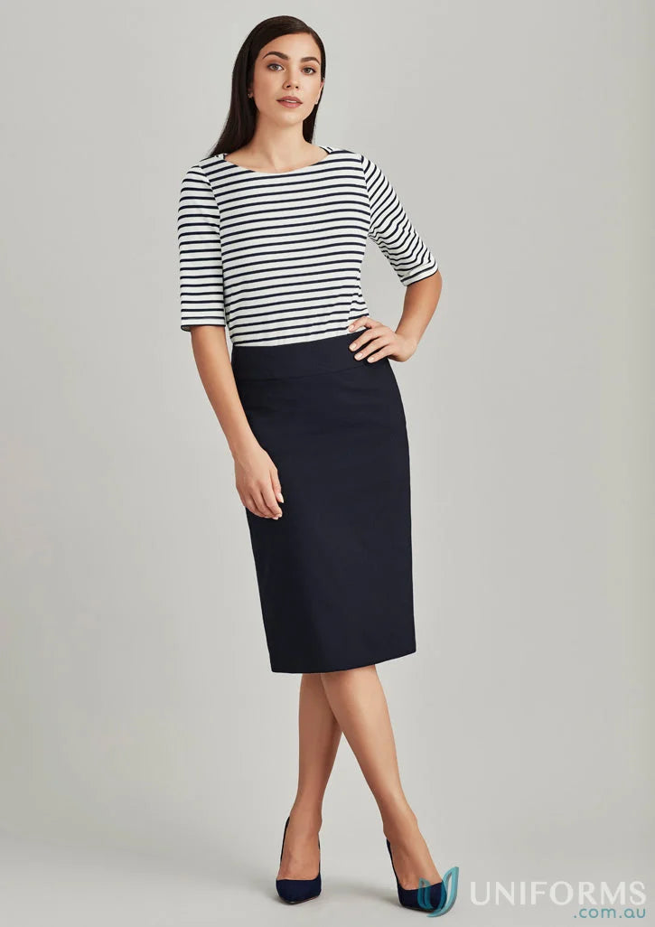Woman wearing a relaxed fit wool stretch skirt and striped long-sleeved shirt