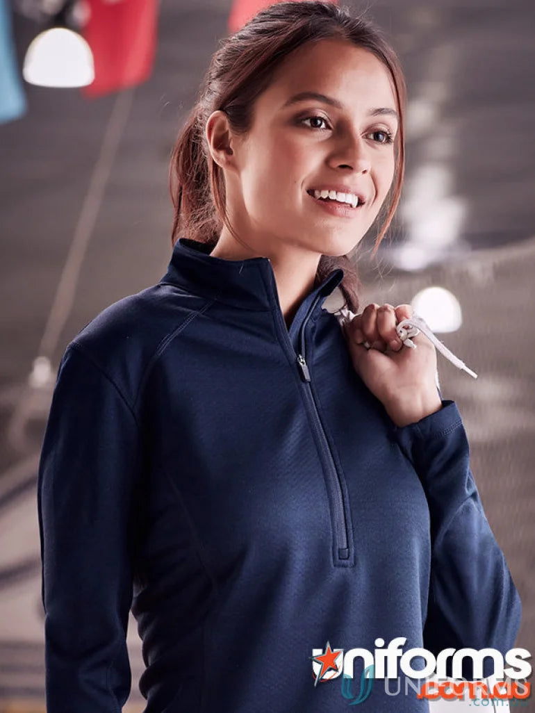 Smiling woman wearing navy blue quarter-zip Monterey Ladies Top from Biz Collection