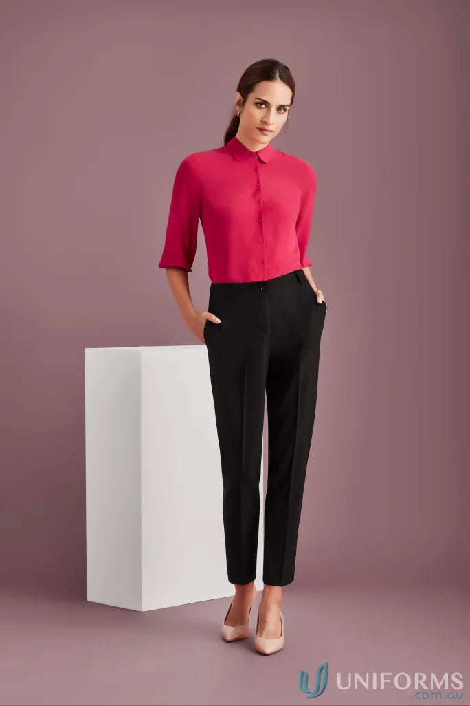 Woman in pink blouse and black pants wearing clearance Siena bandless elastic waist pant