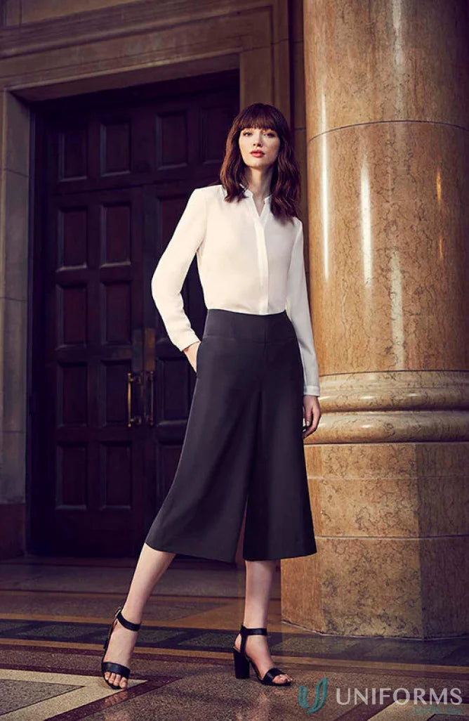 Woman in white blouse and dark culottes showcasing Siena Mid Length Culottes workwear