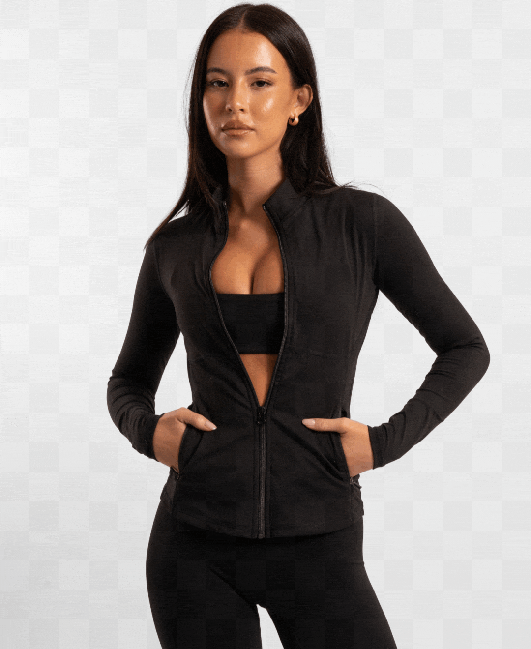 Black long-sleeved contour zip jacket with midriff cut and side pockets ideal for workwear uniforms
