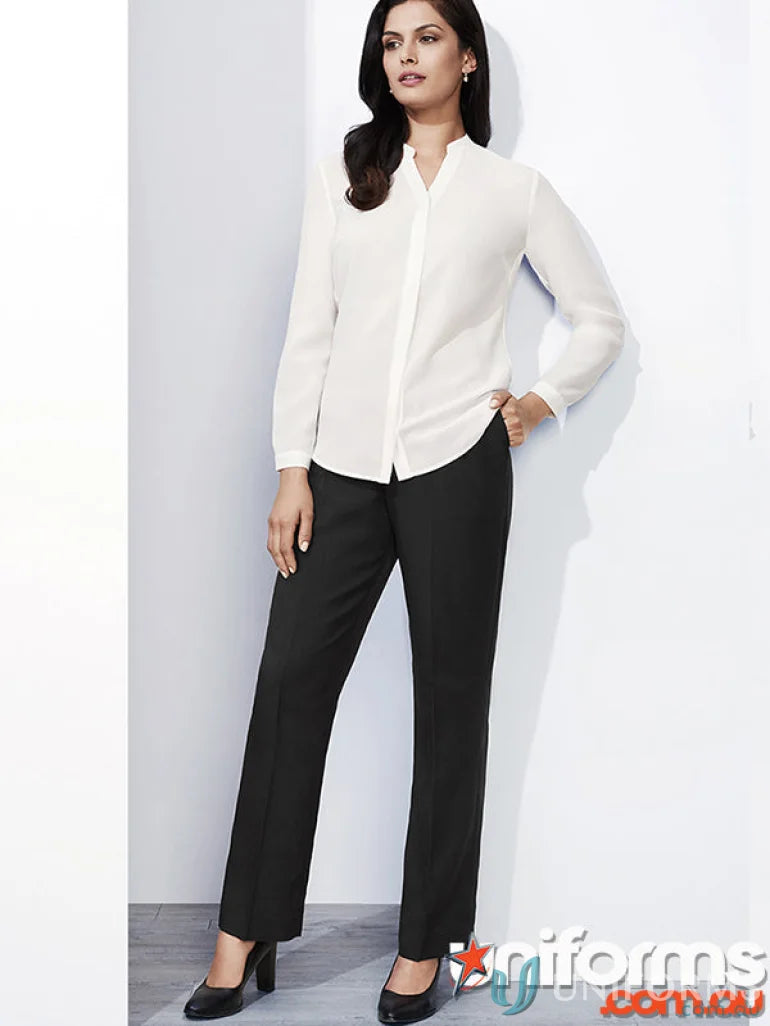 Woman wearing cool stretch easy fit straight leg waist pant in white shirt and black trousers