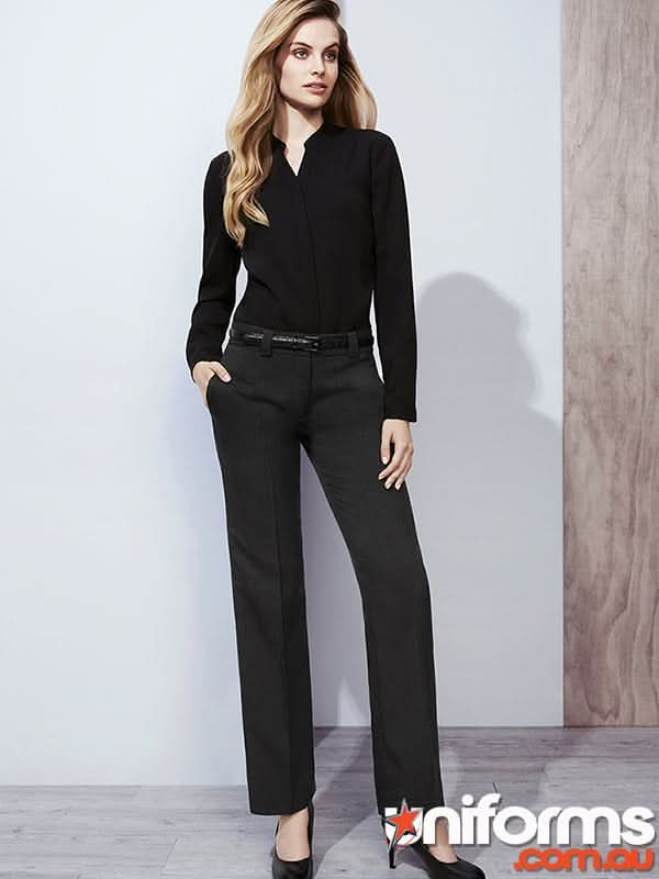 Woman modeling black long-sleeved top and trousers in cool stretch hipster fit workwear