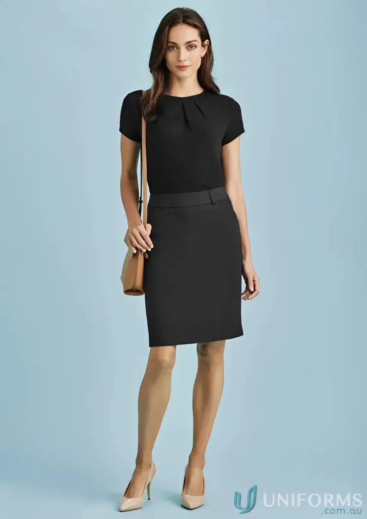 Woman in black blouse and cool stretch bamboo charcoal stretch multi-pleat skirt