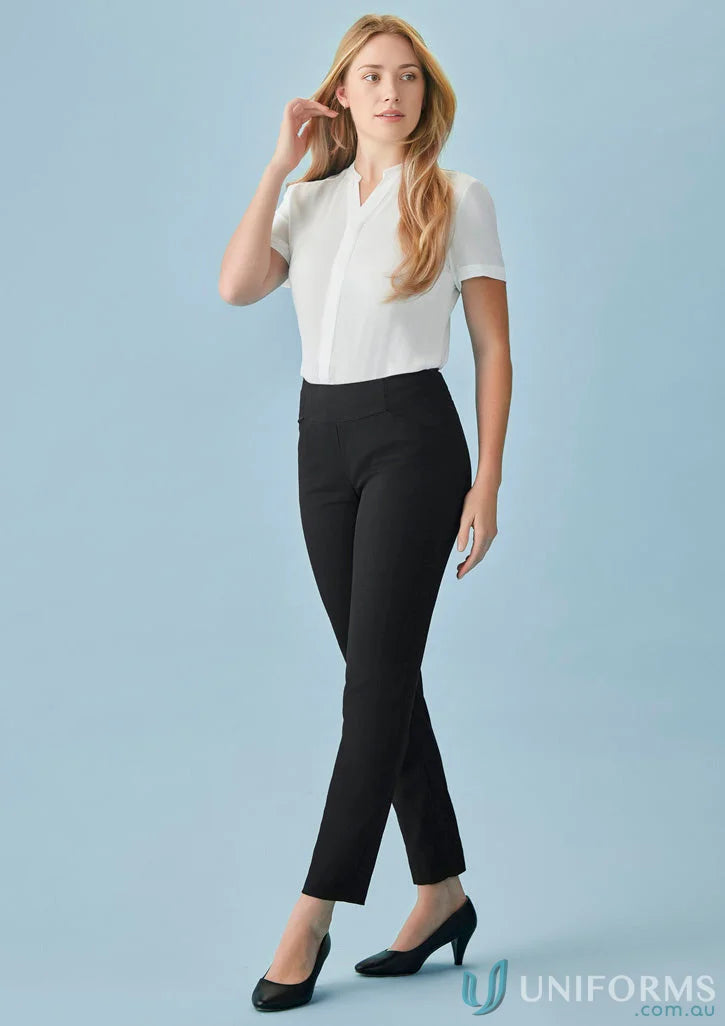 Woman in white blouse and black bandless slim leg pant showcasing cool stretch style