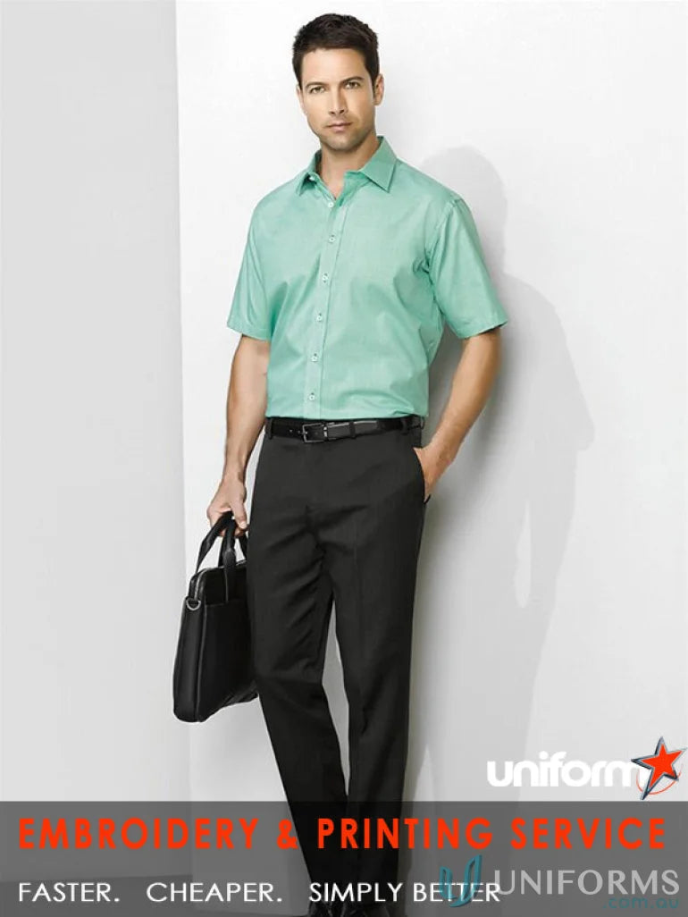 Man wearing cool stretch slimline pant in green shirt and black pants for men’s cool stretch