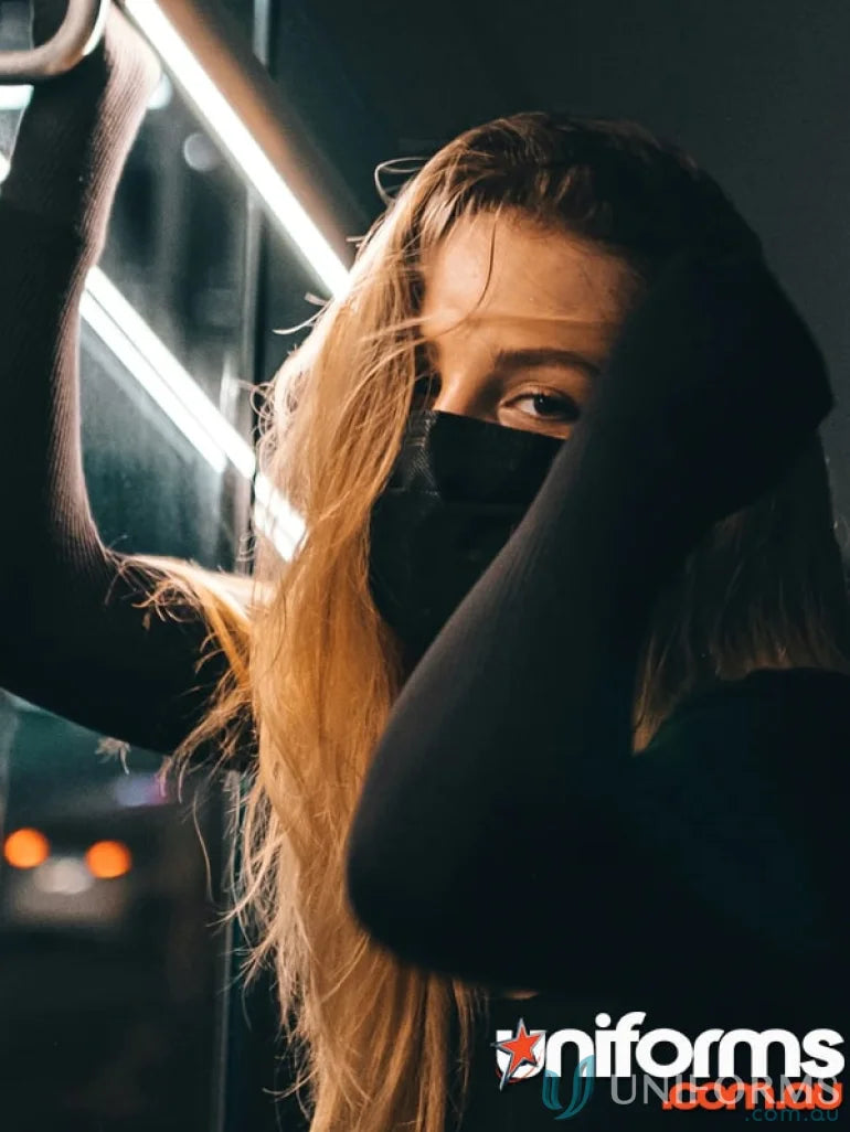 Woman wearing stylish black face masks from Custom Branded Face Masks for uniforms