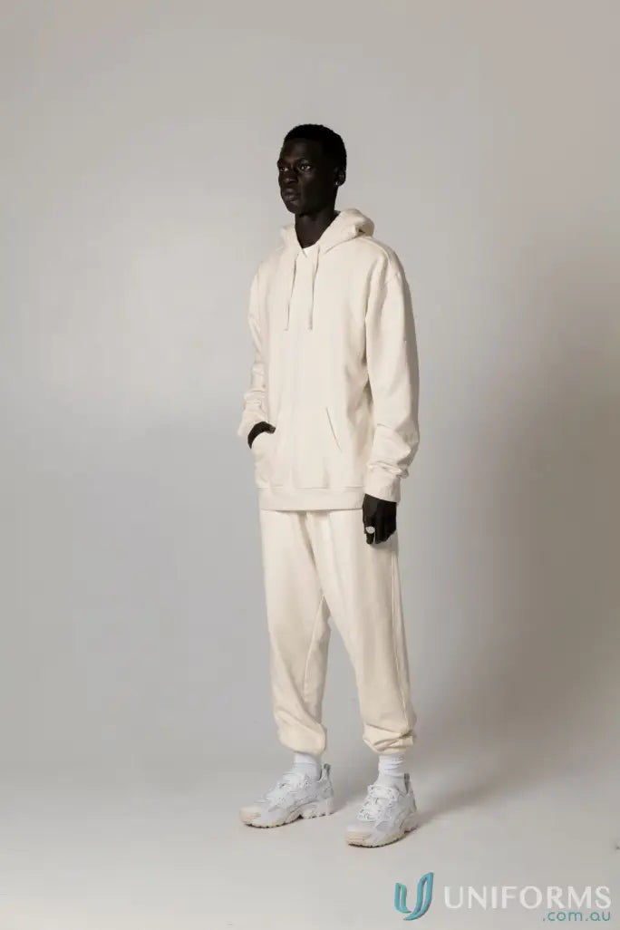 Man in matching Hudson Oversized Cotton Hoodie and sweatpants, garment dyed uniforms