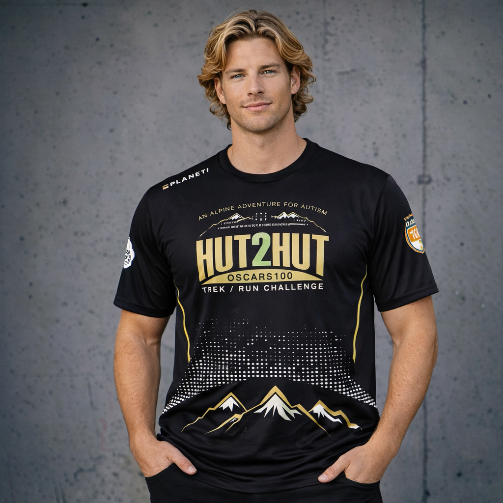 Black premium performance tee with gold mountain graphic and Hut2Hut logos