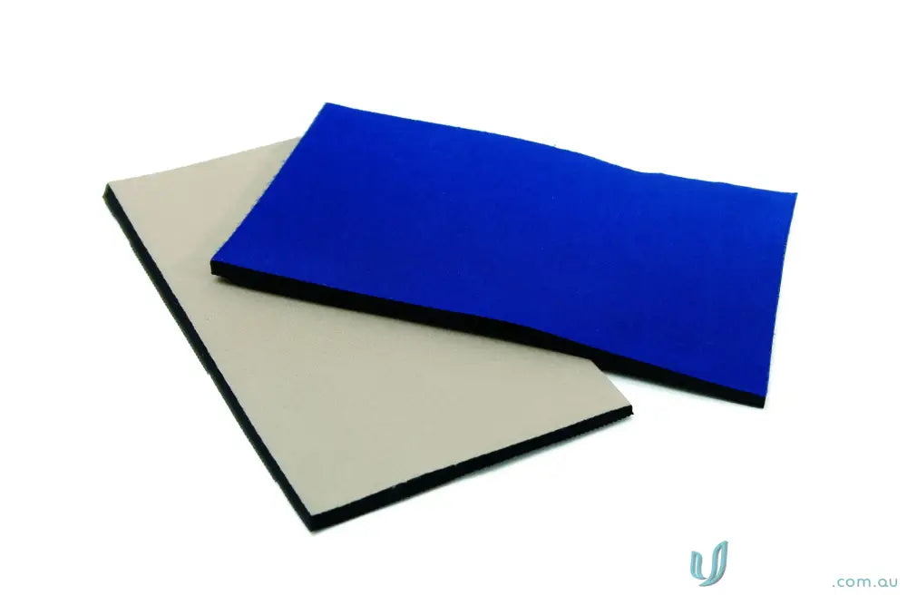 Two neoprene fabric sheets in blue and beige with black edges for DNC knee patch or cushion knee pads