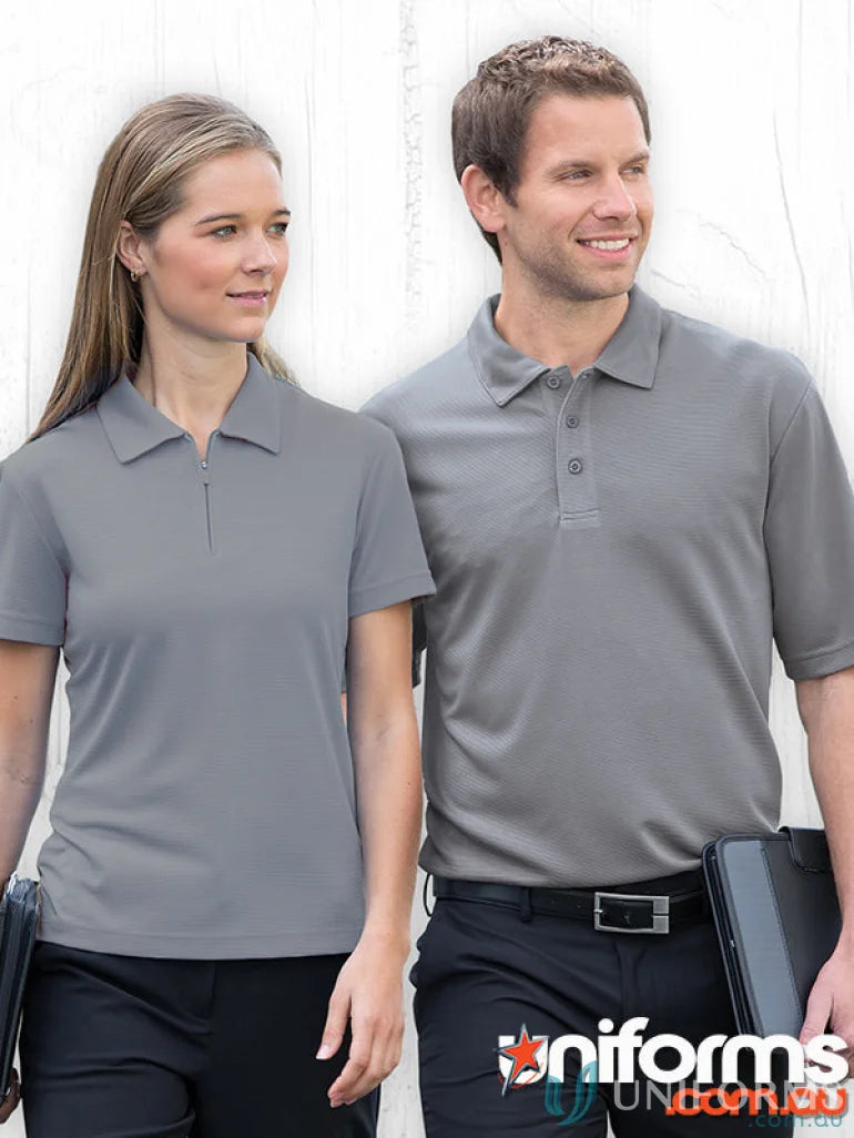 Two people rocking matching drigear ottoman lite polo shirts in style