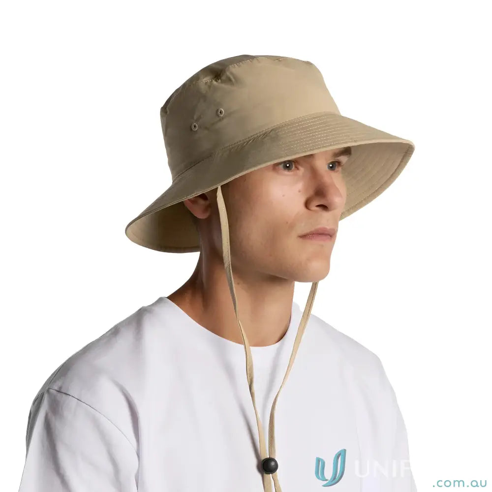 Man wearing a durable nylon wide brim bucket hat with chin strap for sun protection